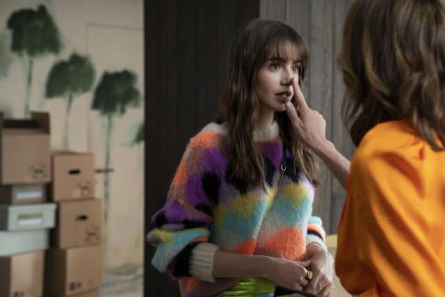 Emily in Paris. Lily Collins as Emily in episode 301 of Emily in Paris. Cr. Stéphanie Branchu/Netflix © 2022