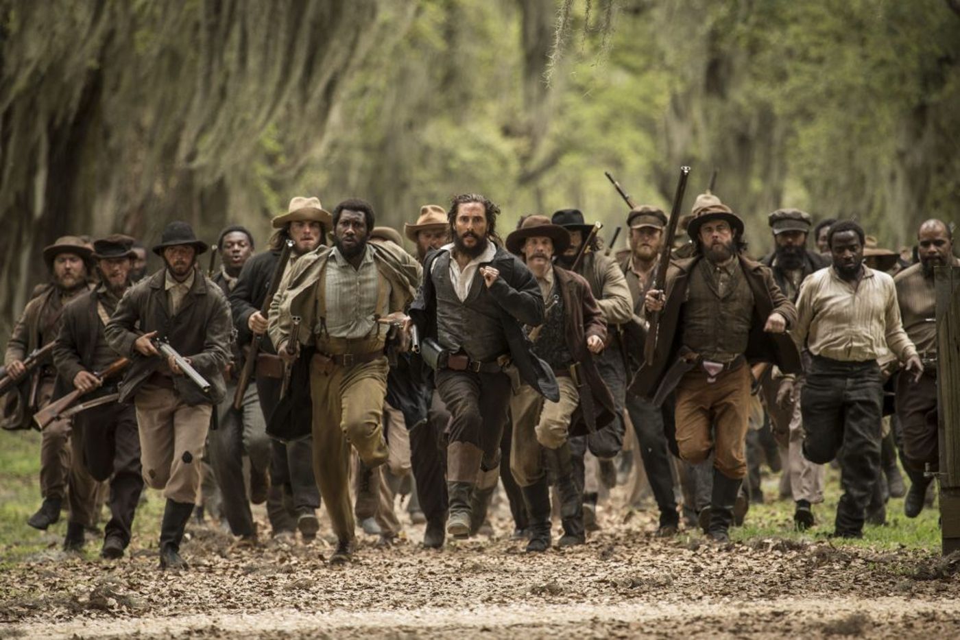 Newt (Matthew McConaughey) and his men (including Mahershala Ali) storm the Deason house